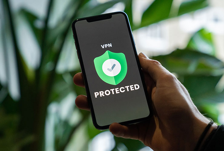 Cybersecurity green Protected shield on mobile phone screen