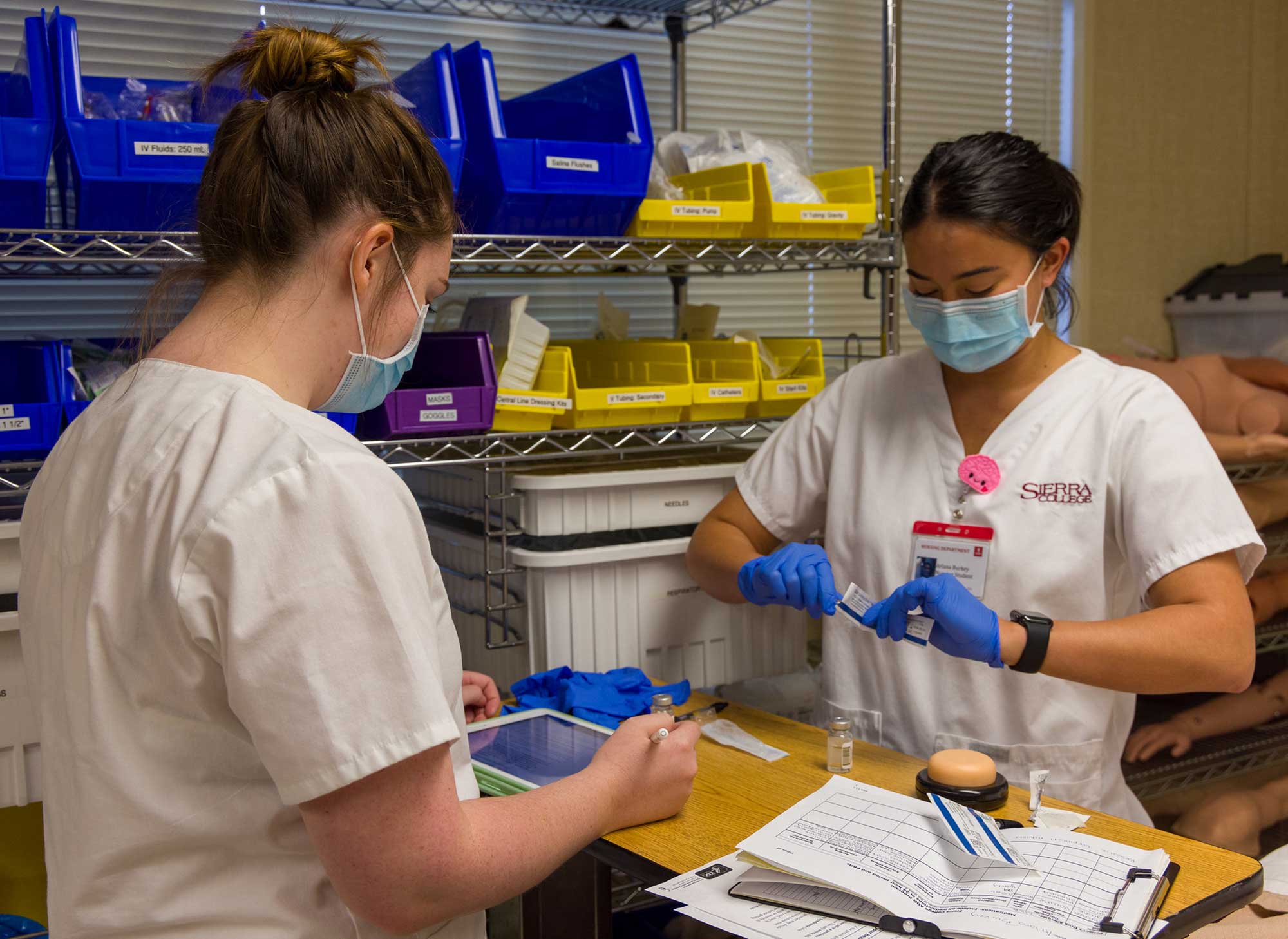 Nursing students preparing syringes to give an injection of medicine