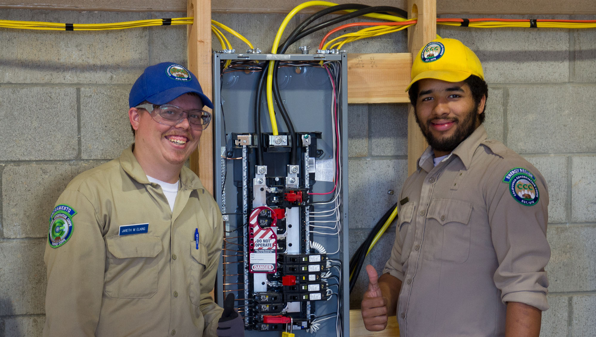 Two male energy technicians gaining knowledge through workplace training