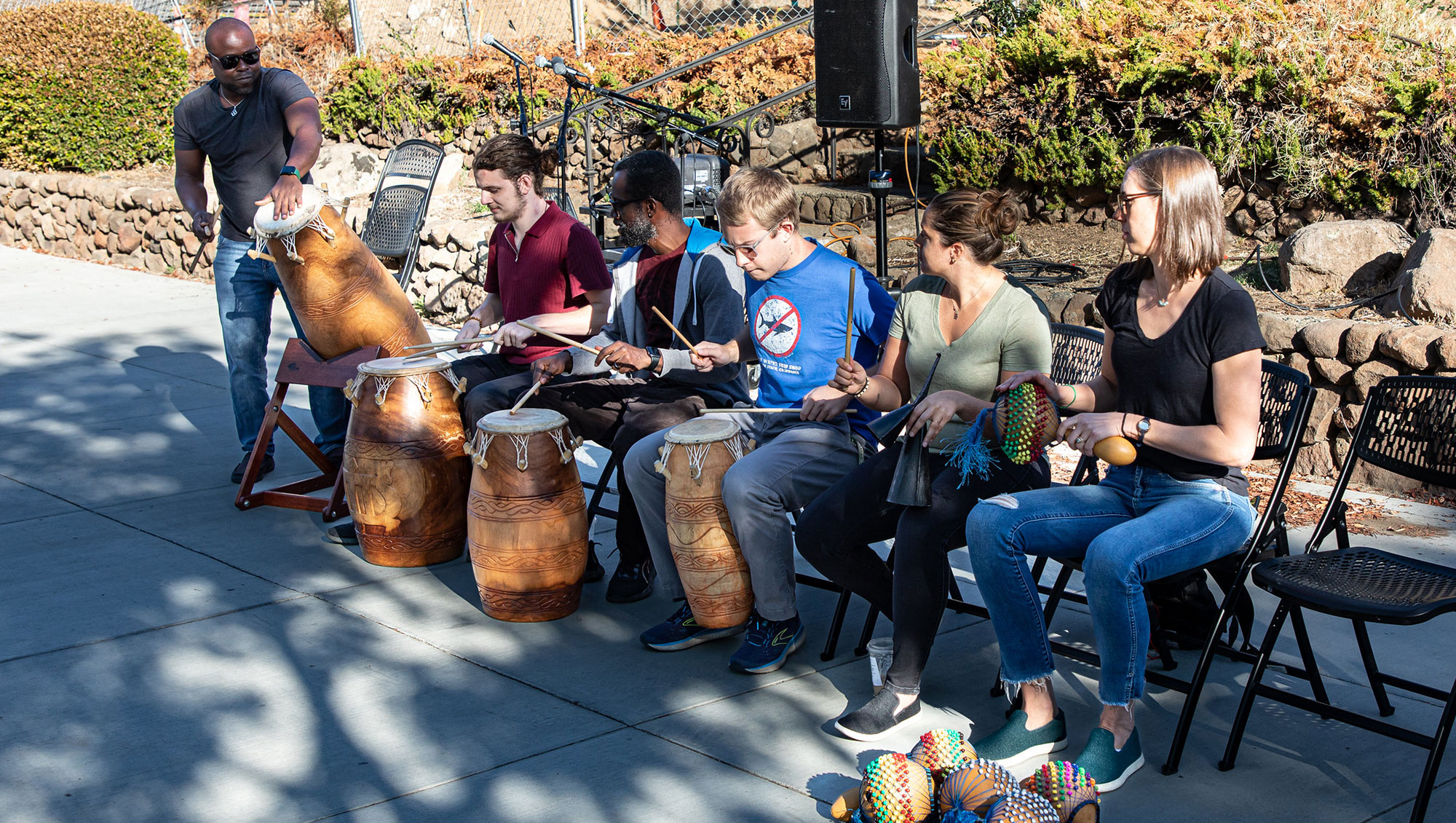 Students learn how to play African drums at People and Culture Days event on Rocklin Campus