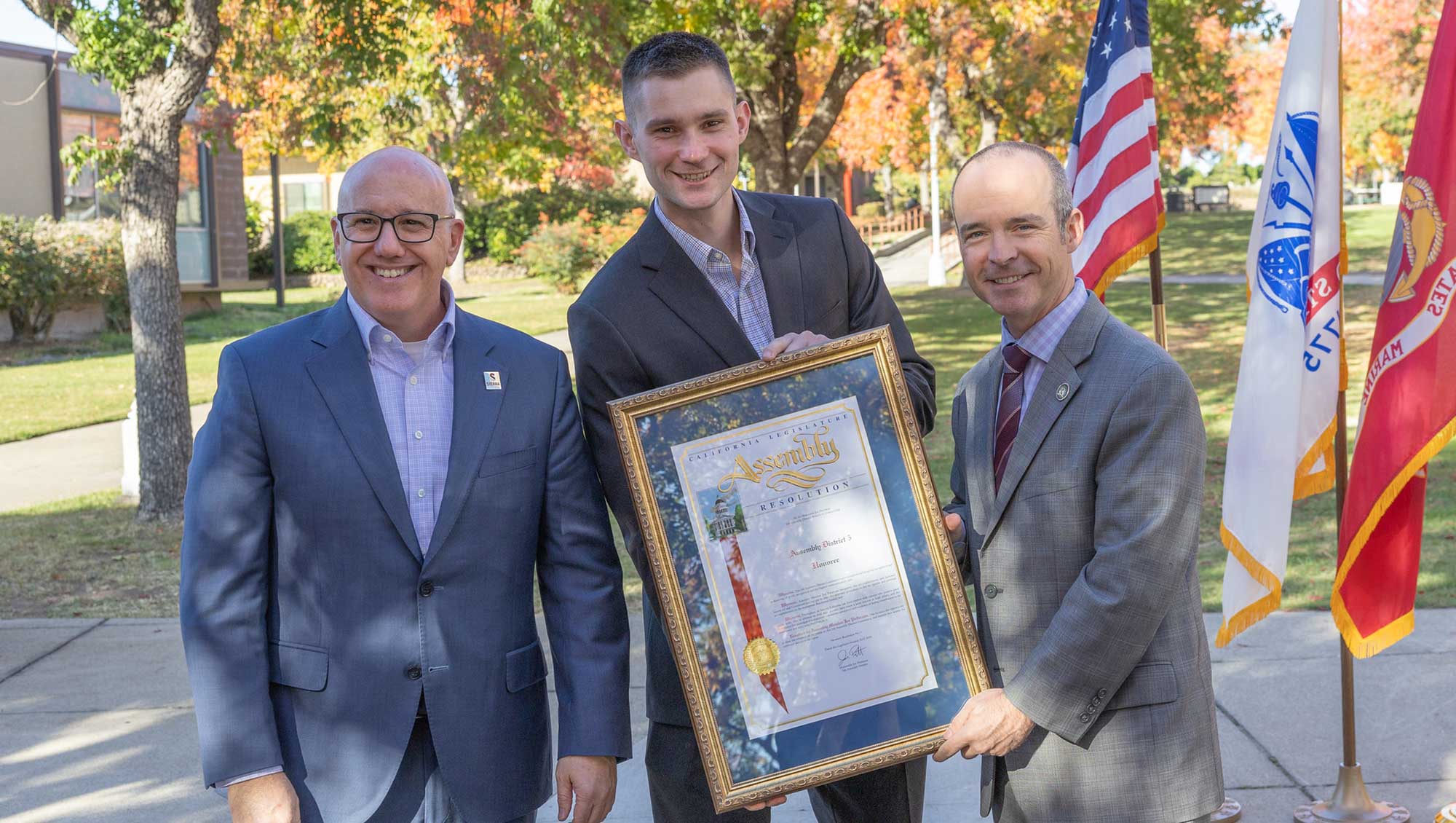 Sierra College Superintendent/President Willy Duncan and Leif Sandness, Veterans Services Specialist accept an Assembly Resolution plaque from California State Assemblyman Joe Patterson