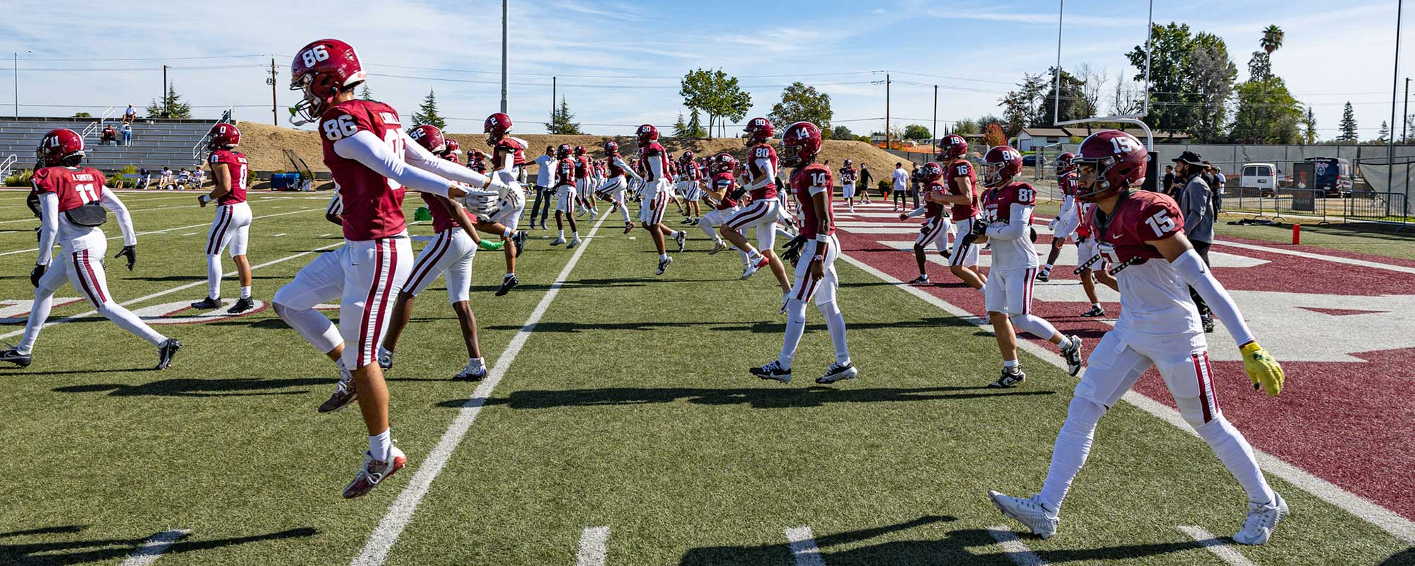 Sierra College football players warming up on field before game